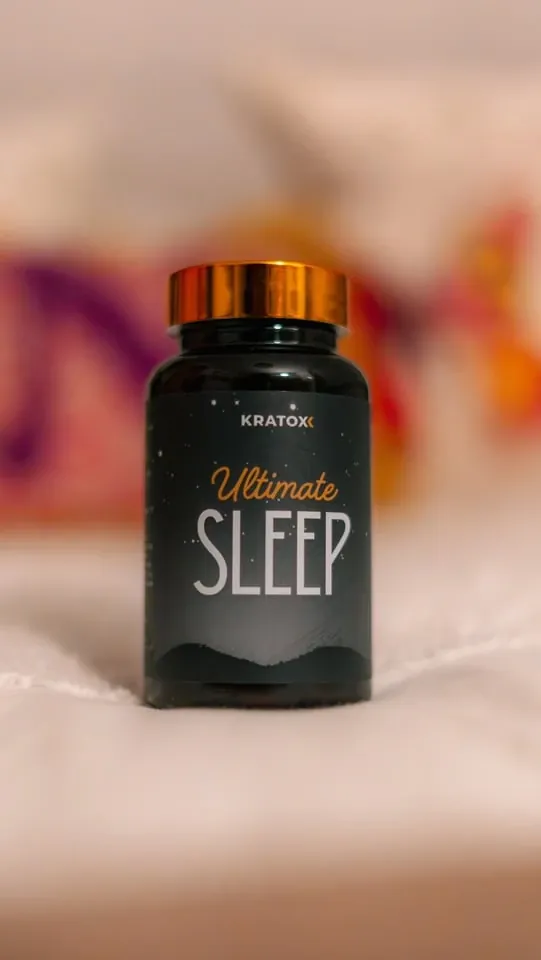 AOB sleep supplement bottle in a bedroom setting