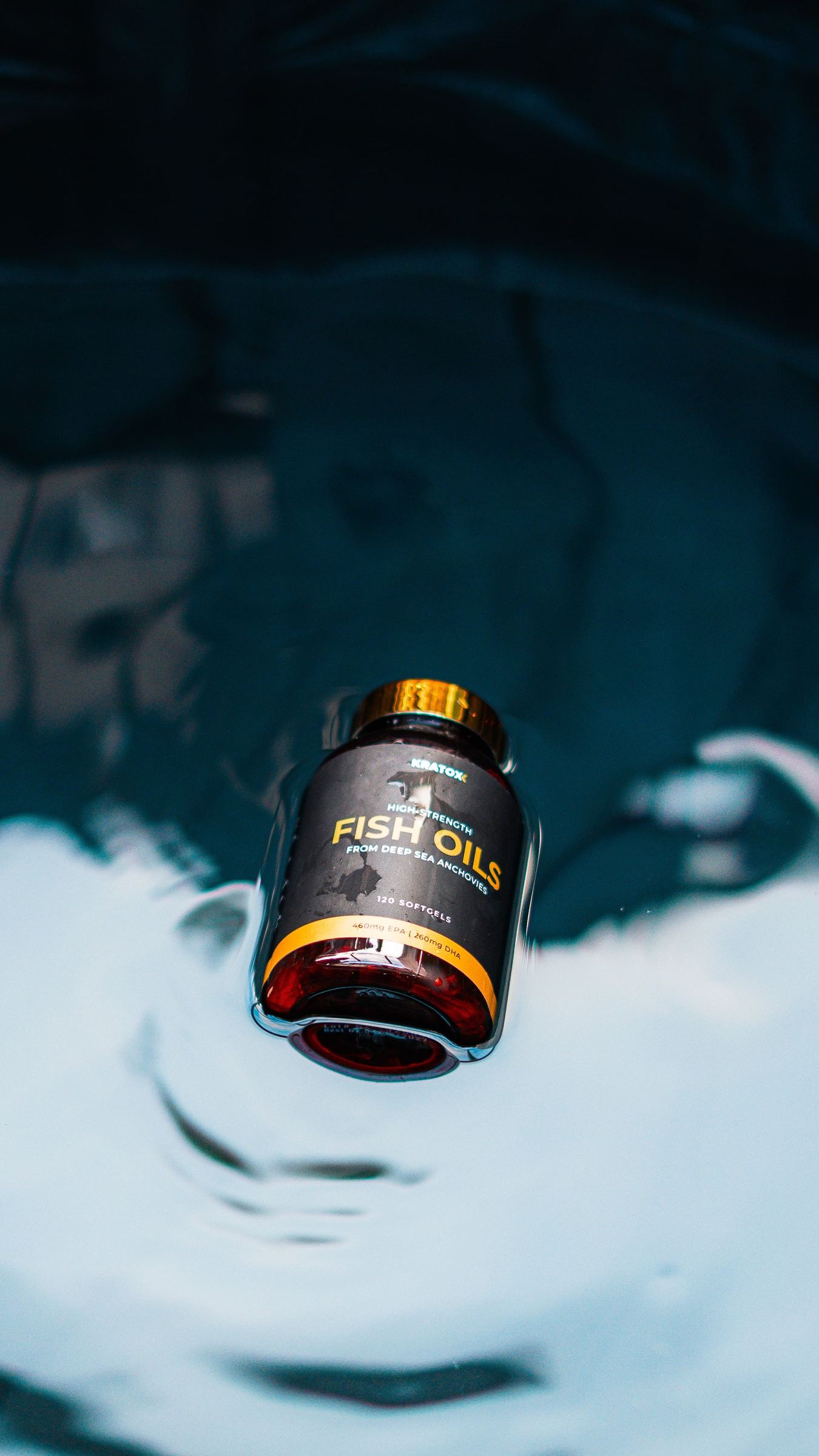 Product bottle reflected in rippling water