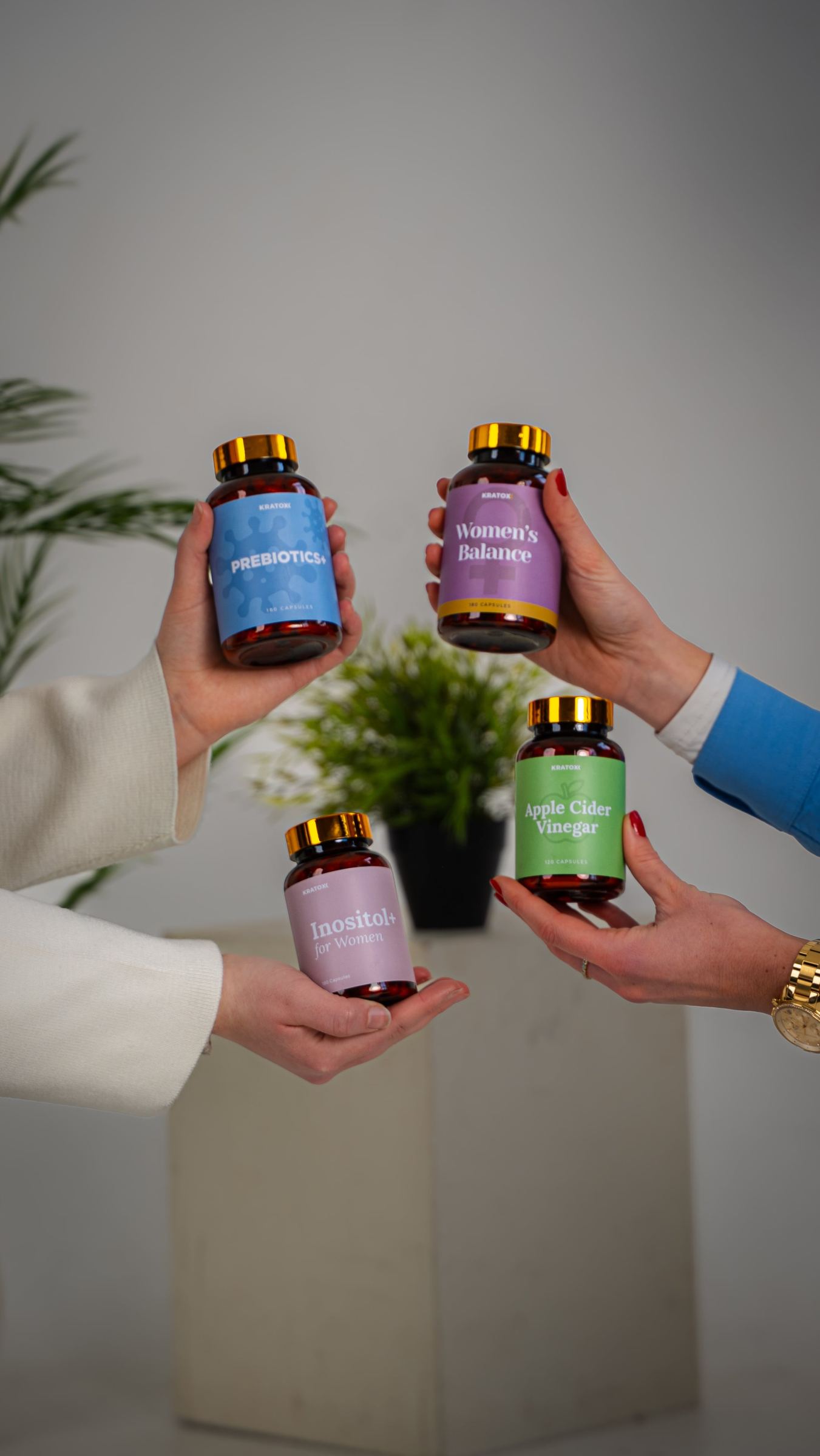 Hands presenting the AOB gummies range