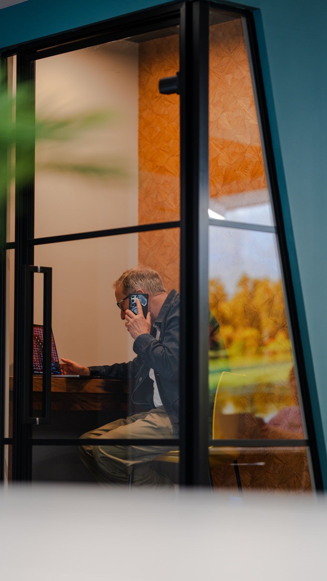 A quiet workspace behind glass at Kindred