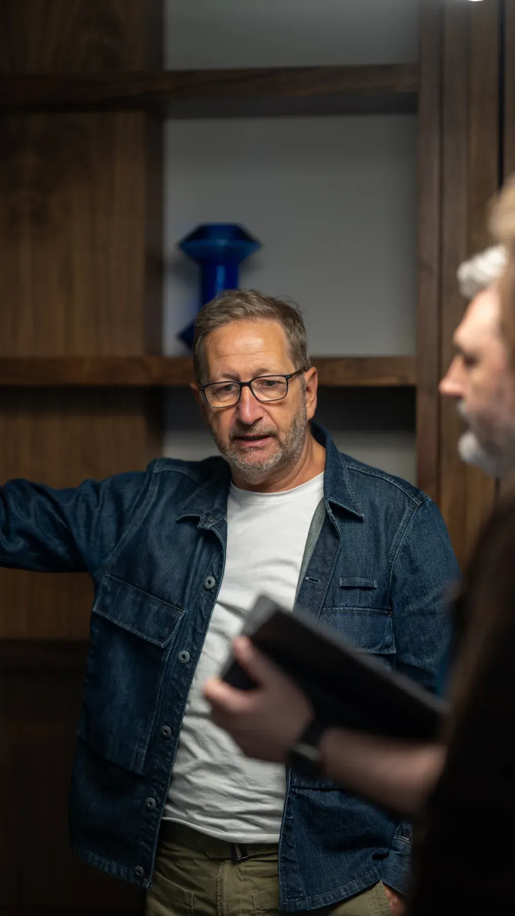 Two people in conversation during an office shoot