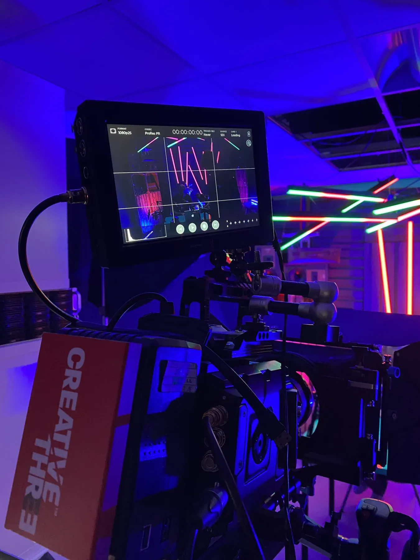 Camera monitor on a colourful illuminated set