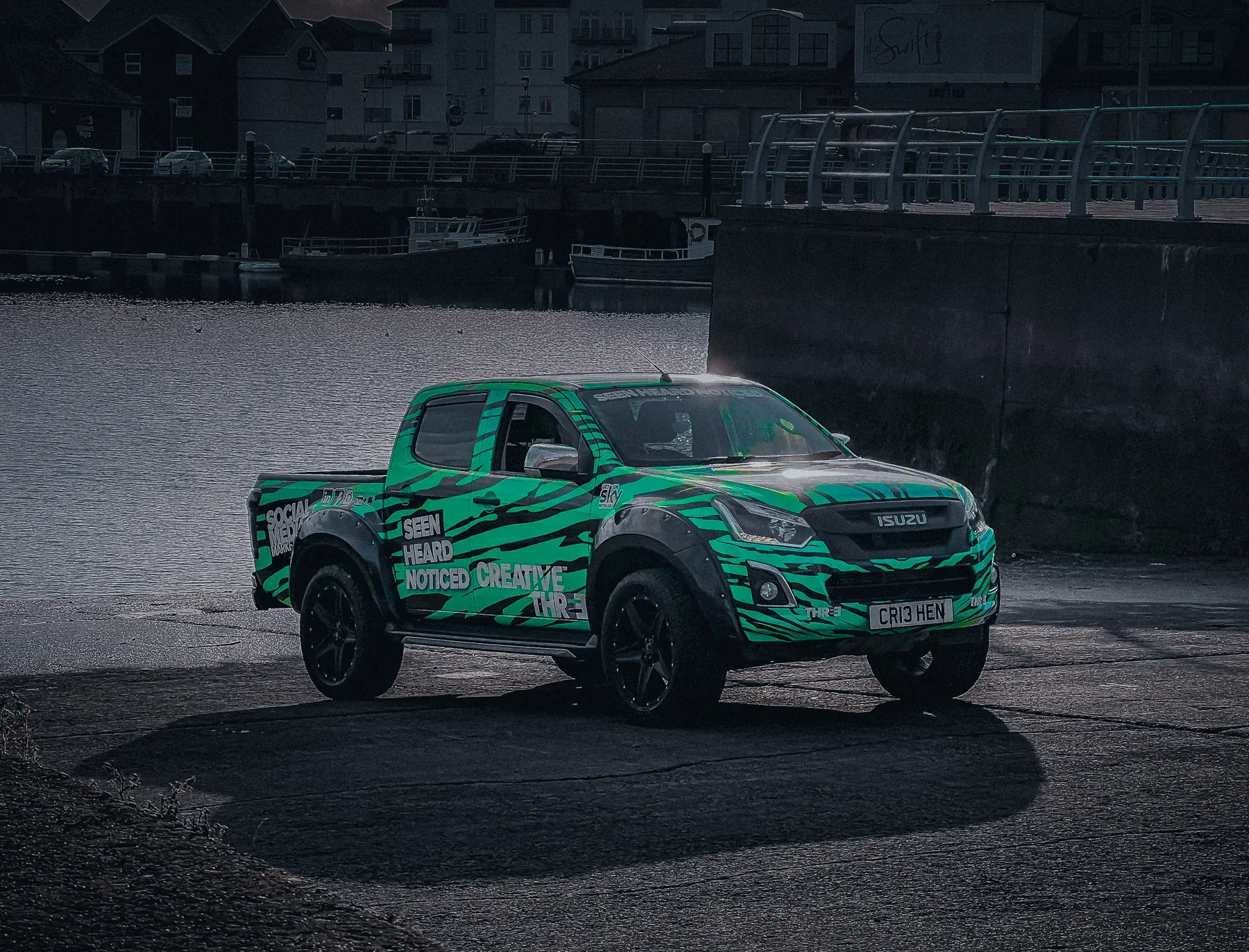 Green patterned pickup photographed on location