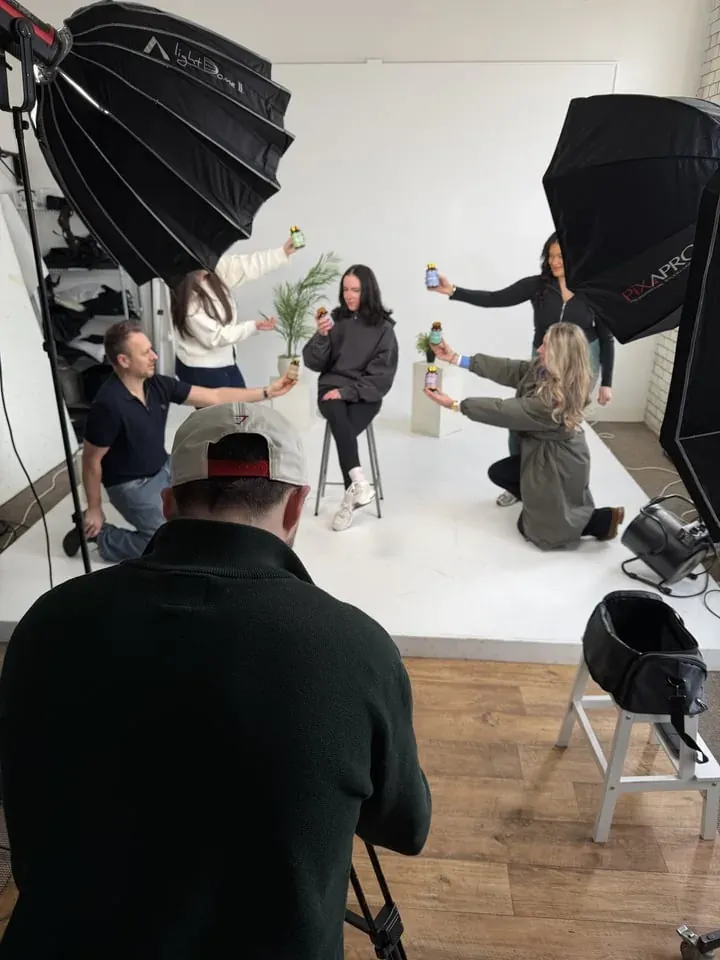 Camera and softboxes framing a studio portrait session